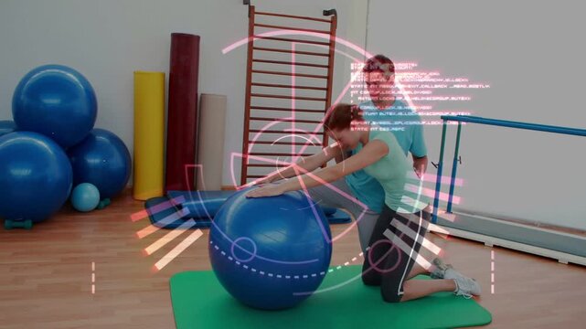 Vertical video: Trainer kneeling holding ball and cueing client leaning forward reaching for rehab