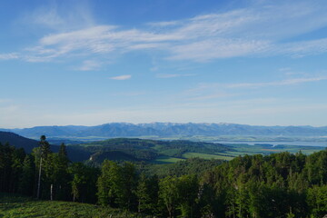 Liptovska Mara, Slovakia, between Tatra mountains. Panoramic View of Mountain Range and Lake Over Lush Green Forest Canopy. © Kamil