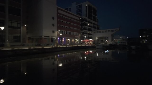 Cinematic POV Shot from a Boat on the Kanaalkom Canal in Leuven at Night