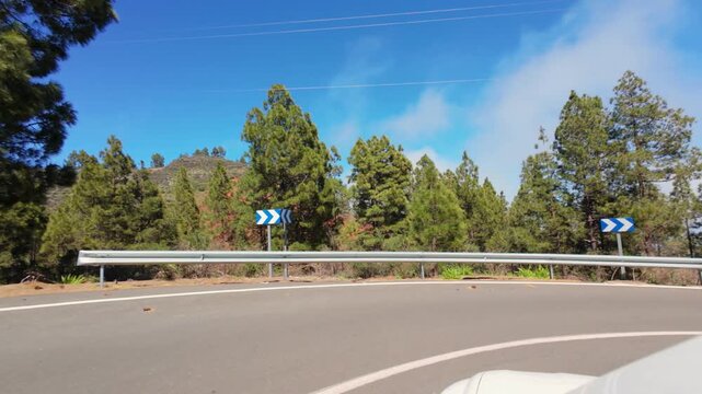 Point of view driving on a scenic mountain road with expansive landscape views in Gran Canaria