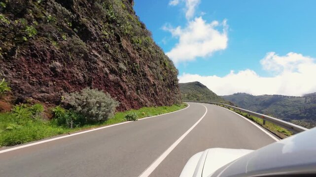 Point of view driving on a scenic mountain road with expansive landscape views in Gran Canaria