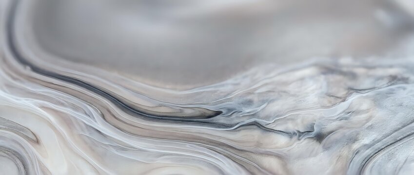 Abstract marble texture with flowing gray and white veins creating elegant natural stone pattern for luxury interior design and sophisticated backgrounds.