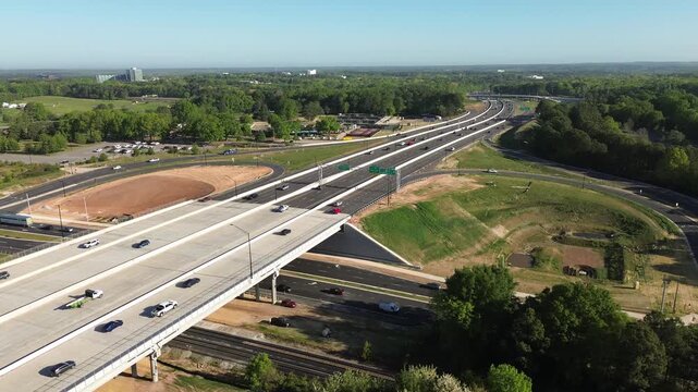 Cars travel on the I-440 and Hillsborough Street interchange during morning rush hour in West Raleigh , North Carolina