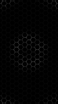 Seamless looping animation of a white hexagon grid on a black background. Symmetrical honeycomb structure with a dynamic, energetic circular pulse effect. High-tech geometric background