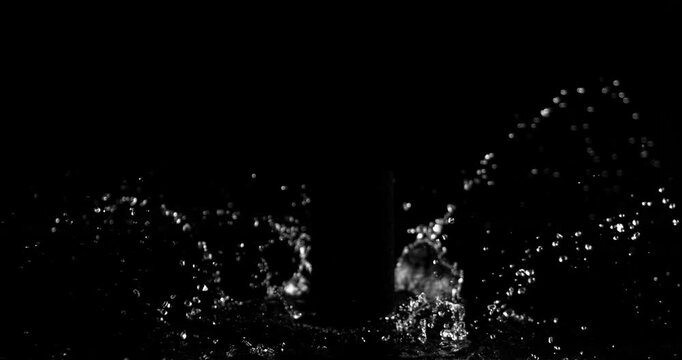 Super slow motion (1000 fps) crown splash of water with hollow black center, isolated on black background. Perfect VFX overlay for product placement, clean cinematic liquid impact.