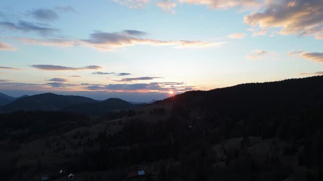 Aerial view of mountain ridges and sunset sky