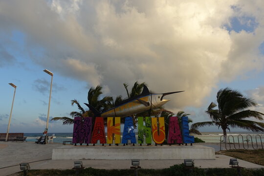 Mahahual Town Sign and Lighthouse at Sunset, Mexico