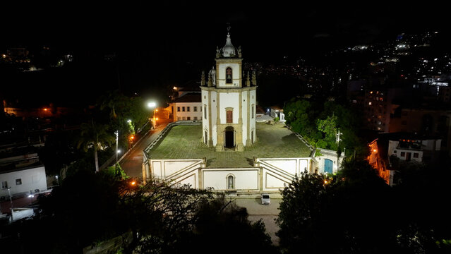 Gloria Church At Night In Rio De Janeiro In Brazil. Illuminated Church Landscape. Downtown District. Highrise Buildings. Gloria Church At Night In Rio De Janeiro In Brazil. 