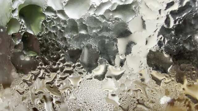 Condensation on glass creating abstract shimmering distortions, perfect for beverage, luxury, and sensory visuals.