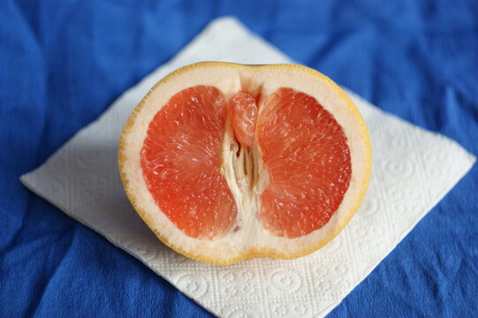 vulva, clitoris and labia symbol. Grapefruit looks like a vulva (vagina), with the clitoris and labia. Female genitalia concept