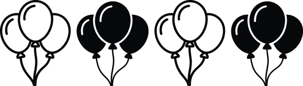 Four sets of black and white balloons tied together in pairs with strings