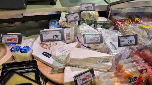 Close-up of cheeses in supermarket deli counter