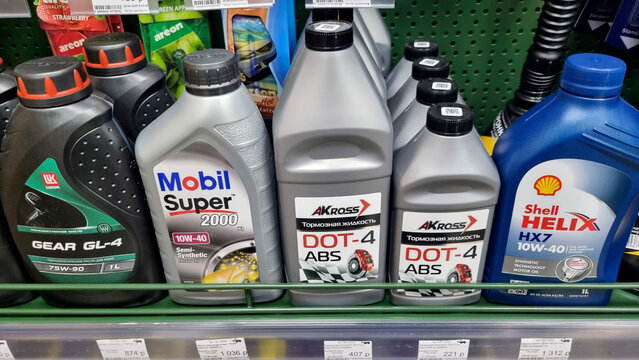 Motor oil and automotive fluids on store shelf