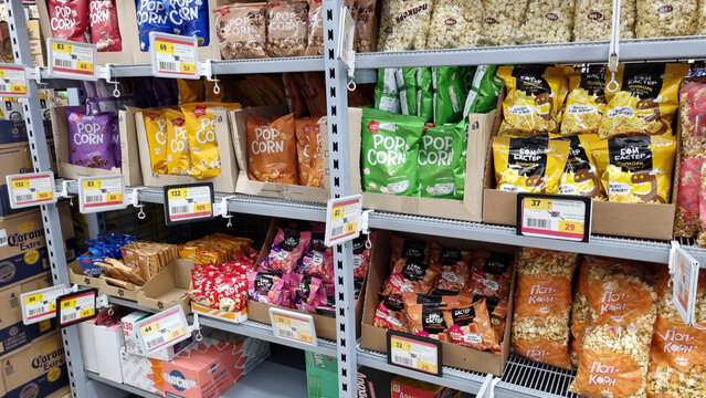 Colorful popcorn snacks on supermarket shelf