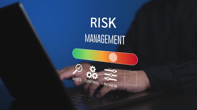 Business professional using laptop with risk management icon. Concept of assessment, control, and identification of financial or operational risks for corporate strategic planning.