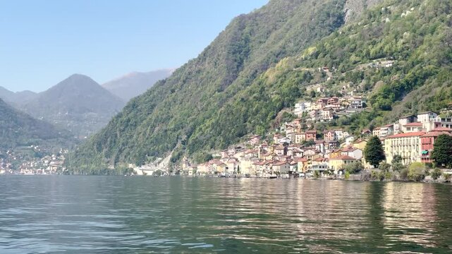 Scenic Lakeside Villages of Lake Como Surrounded by Green Mountains, Italy Travel Destination Landscape Viewed from the Water