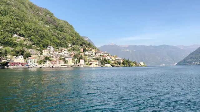 Scenic Lakeside Villages of Lake Como Surrounded by Green Mountains, Italy Travel Destination Landscape Viewed from the Water