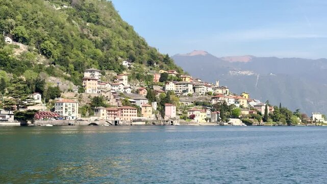 Scenic Lakeside Villages of Lake Como Surrounded by Green Mountains, Italy Travel Destination Landscape Viewed from the Water
