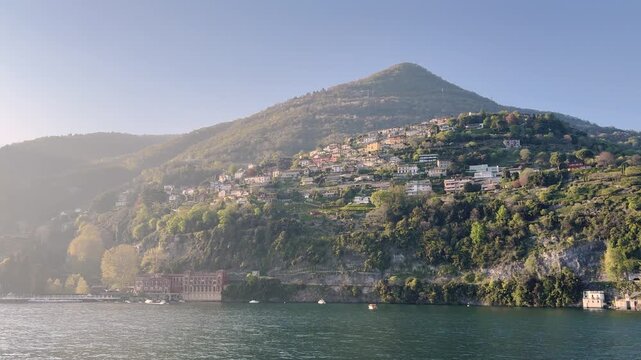 Scenic Lakeside Villages of Lake Como Surrounded by Green Mountains, Italy Travel Destination Landscape Viewed from the Water