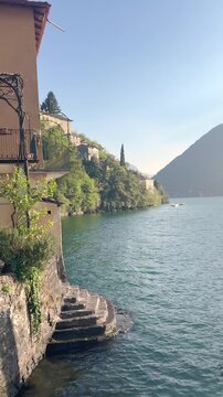 Scenic view of Nesso town Lakeside Villages of Lake Como Surrounded by Green Mountains, Italy Travel Destination Landscape Viewed from the Water