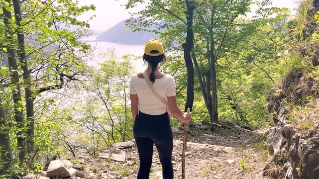 Woman Walking POV on Sentiero di Gandria Lugano, Scenic Olive Trail by Lake, Travel Lifestyle Nature Experience in Switzerland