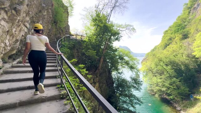Woman Walking POV on Sentiero di Gandria Lugano, Scenic Olive Trail by Lake, Travel Lifestyle Nature Experience in Switzerland