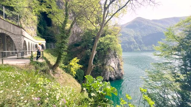 Woman Walking POV on Sentiero di Gandria Lugano, Scenic Olive Trail by Lake, Travel Lifestyle Nature Experience in Switzerland