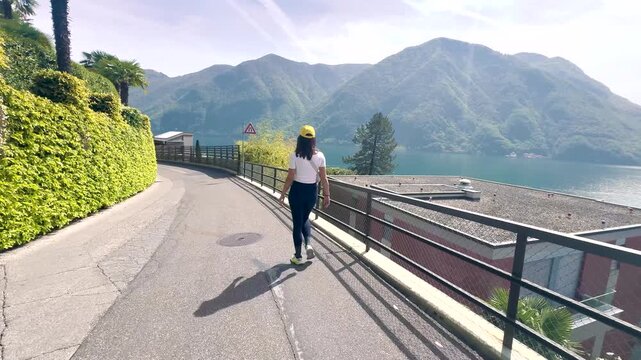 Woman Walking POV on Sentiero di Gandria Lugano, Scenic Olive Trail by Lake, Travel Lifestyle Nature Experience in Switzerland