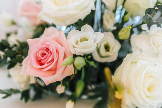 Beautiful wedding bouquet with pink roses and white flowers. Close up