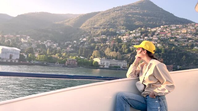 Woman Relaxing on Lake Como Boat Cruise Enjoying Scenic Village Views, Travel Lifestyle Experience in Italy Tourism Destination