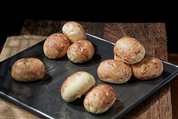 Fototapeta premium Multigrain potato buns are placed on a sushi mat.