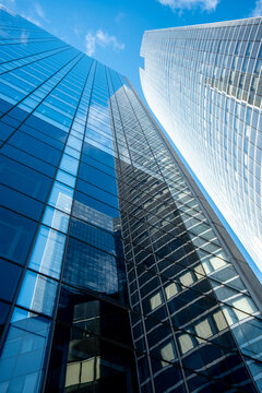 Glass reflection on a tower skyscraper architecture for business finance in urban Paris La Defense showing strong lines and modern city growth