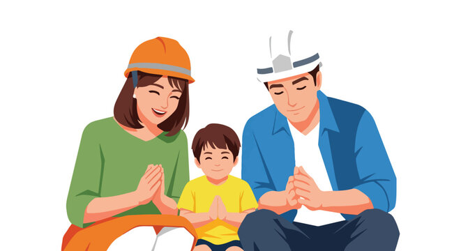 A smiling family wearing construction hard hats and praying with clasped hands