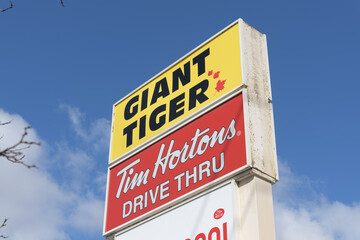 Naklejka premium roadside pylon with Giant Tiger and Tim Hortons signs at 682 Kennedy Rd (Kennedy Park Plaza), Scarborough, Toronto