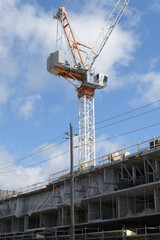 Naklejka premium construction crane and building site of Nahid Kennedy, a 10-storey boutique condominium currently under construction at 615 Kennedy Rd (at Corvette Avenue), Scarborough, Toronto