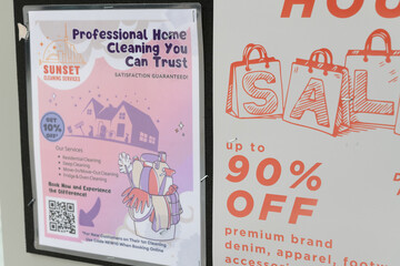 Naklejka premium close-up of street posters in Toronto (cleaning services and warehouse sale)