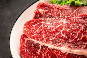 Obraz premium Raw beef steak marbled meat veal tasty snack fresh delicious gourmet food background on the table rustic food top view copy space