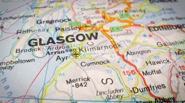 cinematic glide over road map showing highway network toward glasgow, uk