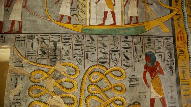 KV16 royal tomb of Ramesses I, Valley of the Kings, Luxor, Egypt, depicting processions of gods, mummiform figures and hieroglyphics on grey and golden walls.