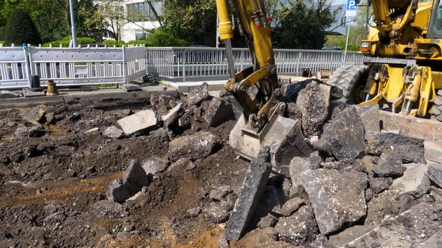 Wiesbaden, Germany - April 15, 2026: Large earth movers and bulldozer at different construction sites and road works in the city center of Wiesbaden
