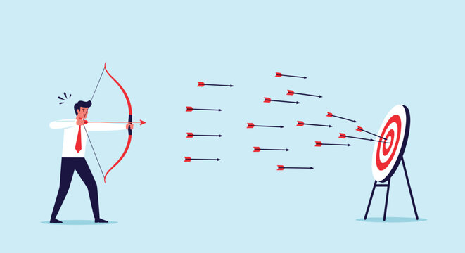 Determined businessman aiming a bow and arrow at a target while many previous failed arrows have landed unsuccessfully on the ground nearby.