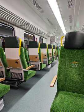 Warsaw, Poland, October 13, 2025: Empty seats inside the modern FLIRT electric passenger train, operated by Polish Railways, travel through Warsaw.