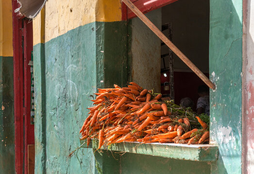 Cuba, Havana.  Carrots for sale at small private store in Old Havana.
