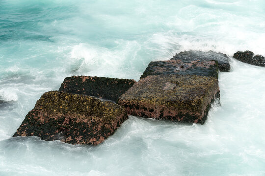 Cuba, Havana.  Old blocks of stone in the harbour, serving as a breakwater along side of the Malec&oacute;n.