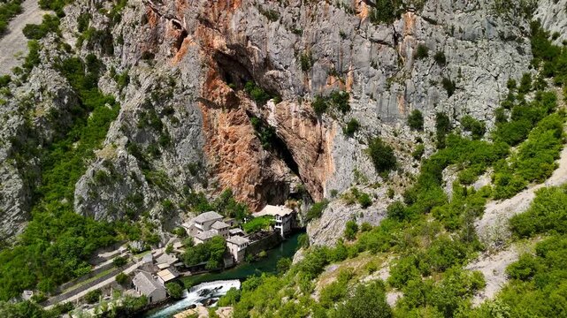 Aerial drone view of the Tekija in Blagaj, Bosnia and Herzegovina. It rises atop a karst hill near Mostar. The Tekija, a dervish house, is located at the source of the Buna River.