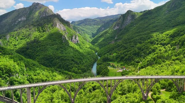 Aerial drone view of the Djurdjevica Tara arch bridge over the Tara River canyon, Montenegro. 