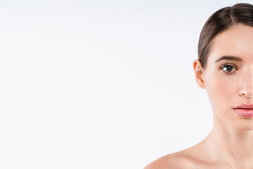 Naklejka premium Portrait of woman half face with healthy skin isolated on white background, beauty concept, clean smooth complexion, skincare, facial care and copy space for cosmetic advertising banner