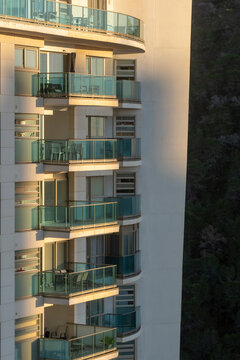 Sunlight on modern facade shows balcony windows and apartments of residential architecture in Benidorm Spain contemporary housing exterior