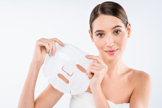 Woman with perfect skin wearing textile face mask isolated on white background, skincare treatment, facial care routine, hydration therapy and beauty wellness concept