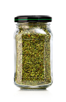 Dried oregano glass jar on white background